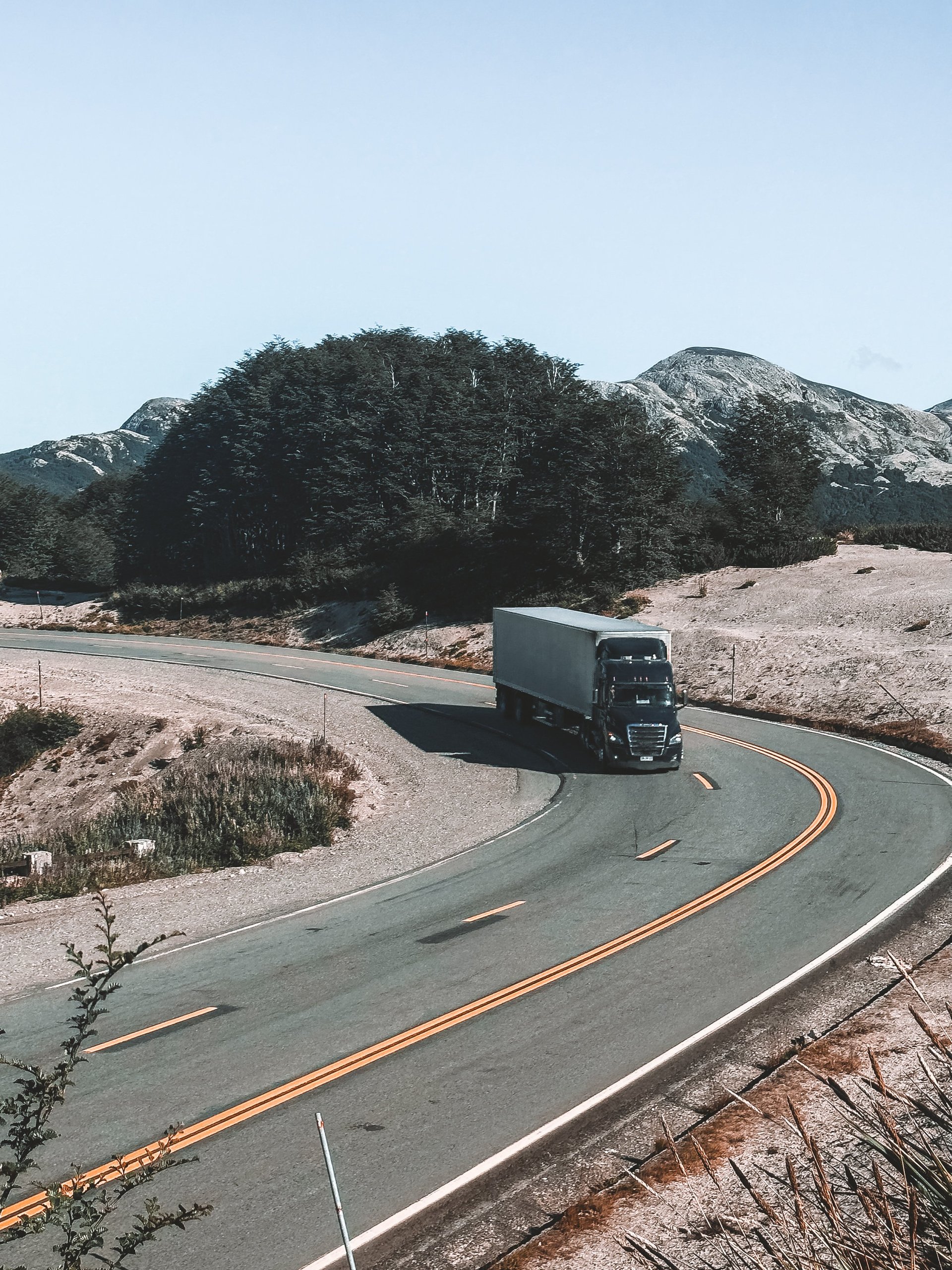 Semi-truck navigating mountain road in Chile